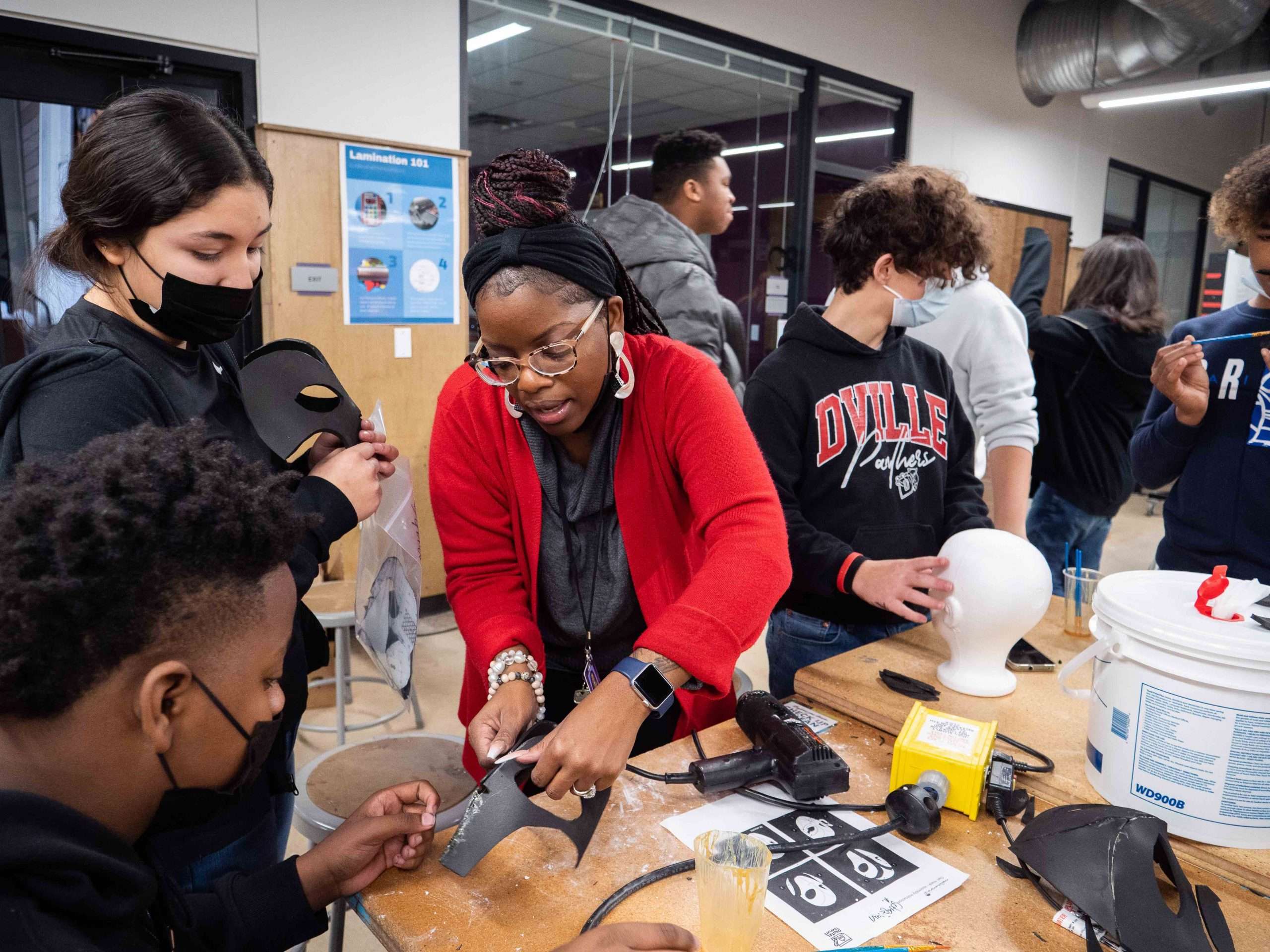 Village Tech students making speed masks